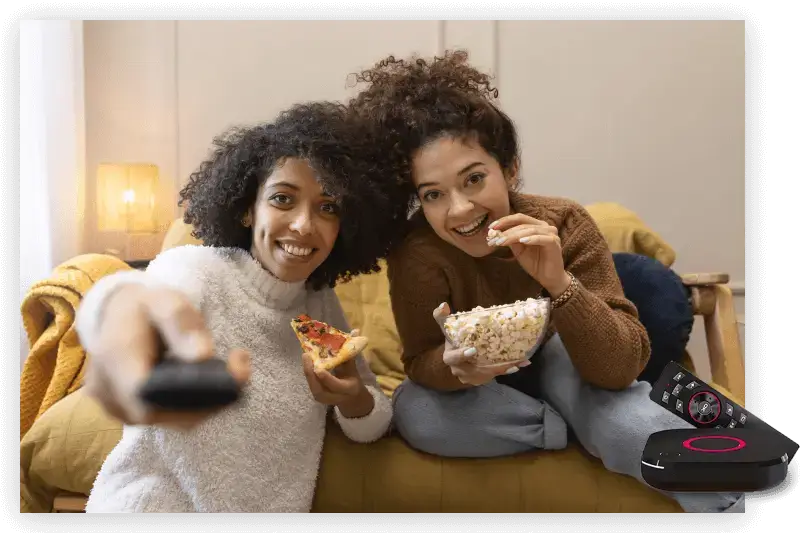 Happy family watching movies with IPTV Services USA on Smart TV and IPTV device